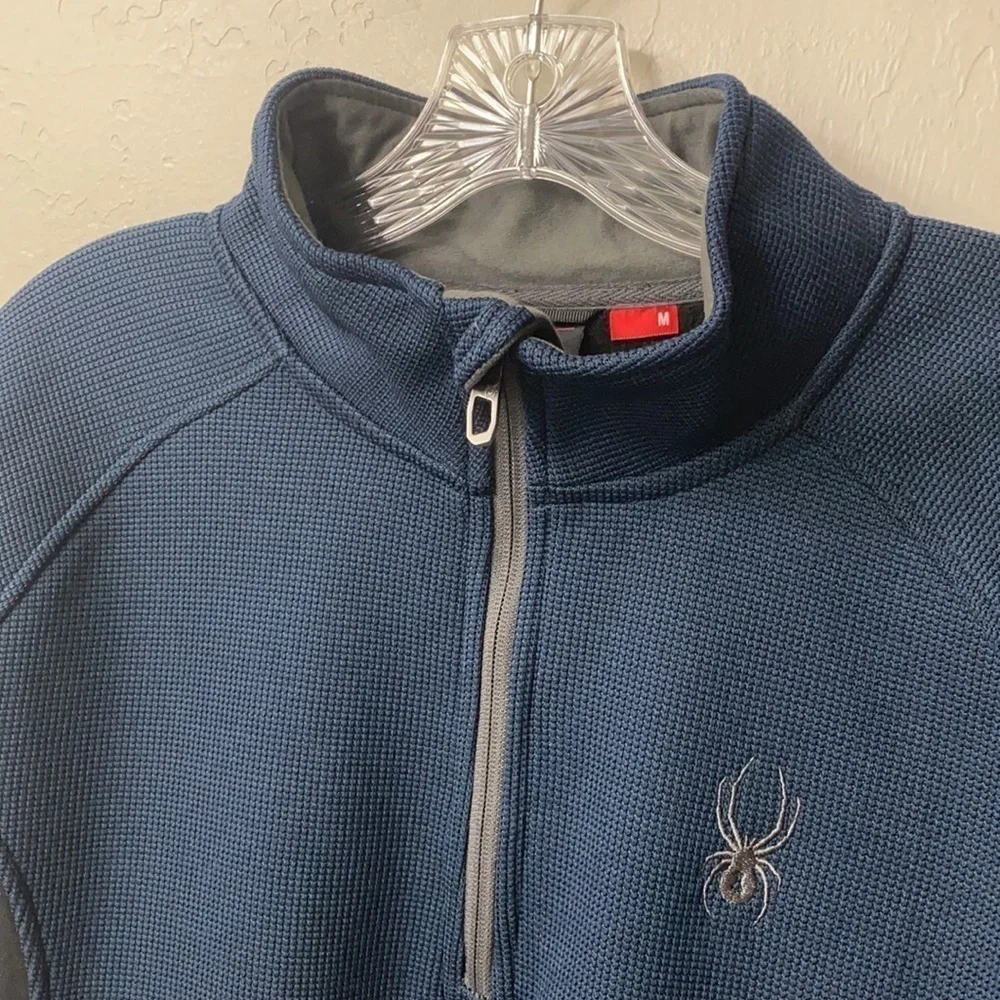Spyder 1/4 zip Blue and gray jacket size medium.